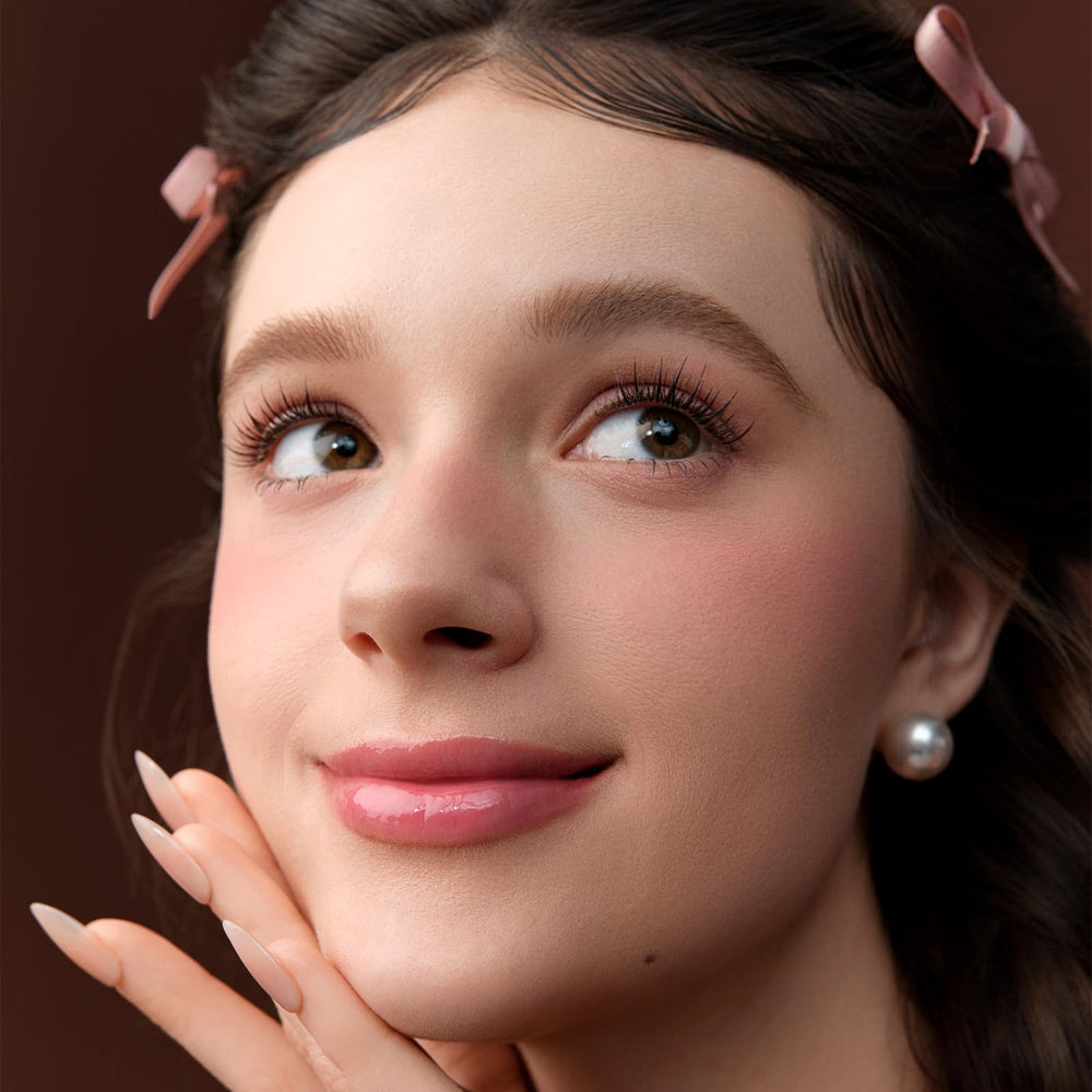 Flower Knows Lip Jelly cap features a heart-shaped accent for charm