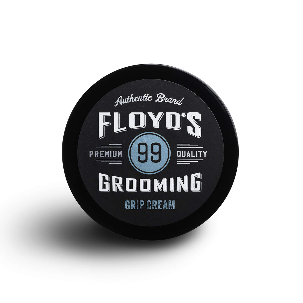 Floyd's 99 Grooming Grip Cream packaging close-up, travel-friendly design.