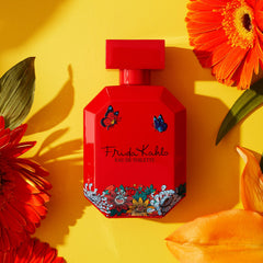 Frida Kahlo bottle detail with floral accents enhances shelf appeal.