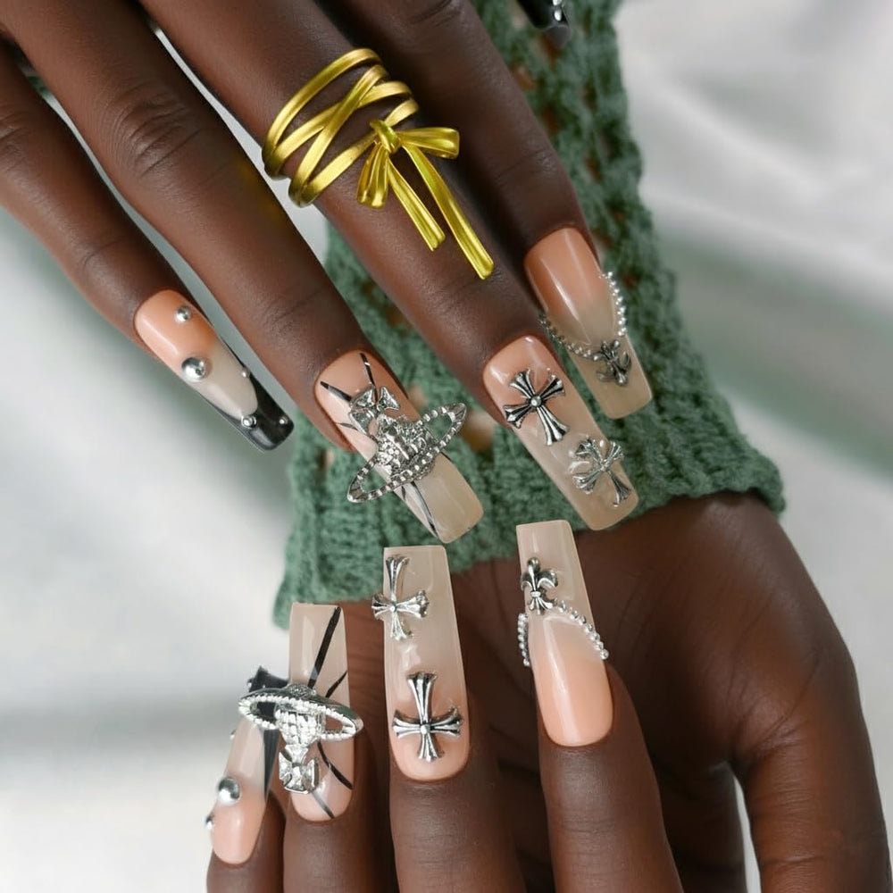 Furnunubi 3D Saturn nail design with charms adds unique texture and shine.
