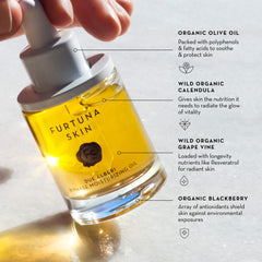 Furtuna Skin Biphase Oil being shaken to mix phases for optimal hydration.