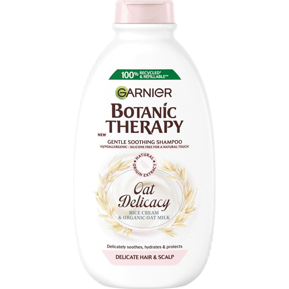 Garnier Botanic Therapy shampoo bottle close-up showing oat milk formula for sensitive scalps