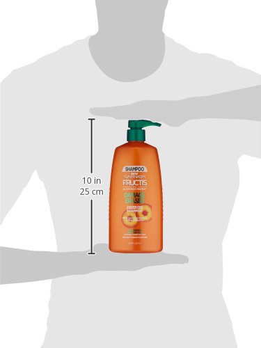 Hands applying lather from Garnier Fructis Damage Eraser shampoo for damaged hair.