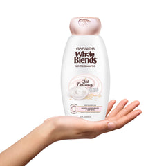Garnier Whole Blends Gentle Shampoo on sensitive scalp, ideal for daily use.