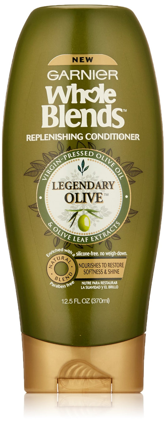 Garnier Whole Blends Legendary Olive conditioner bottle provides nourishing care for dry hair.