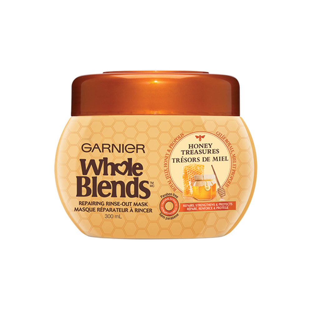 Garnier Whole Blends Honey Treasures mask bottle ready to nourish dry hair.