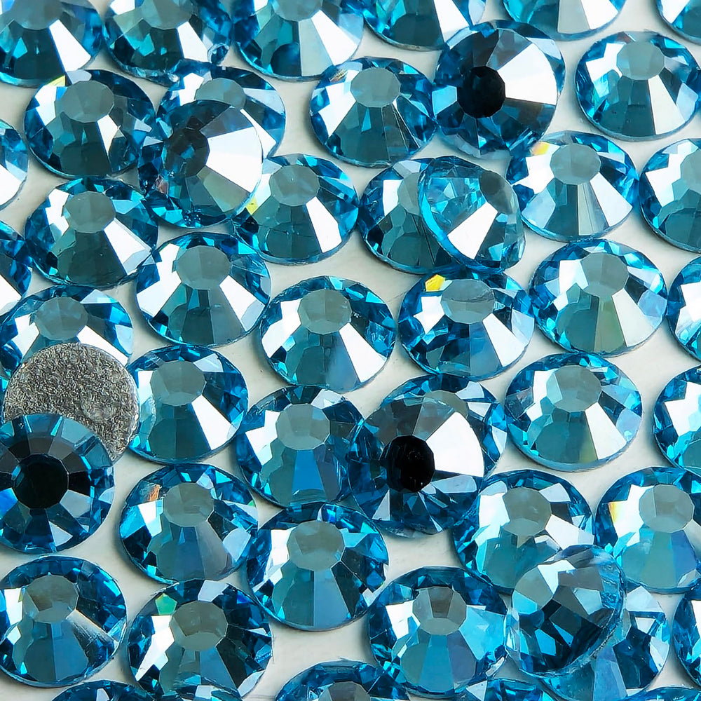Genie Crystal nail art with Ice Aquamarine rhinestones for delicate accents.