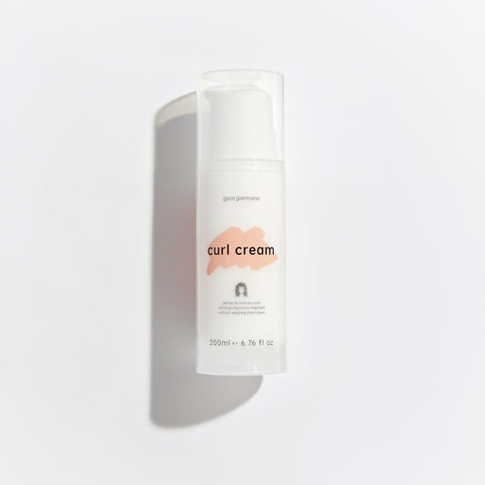 Georgiemane Curl Cream bottle for defined curls and moisture.