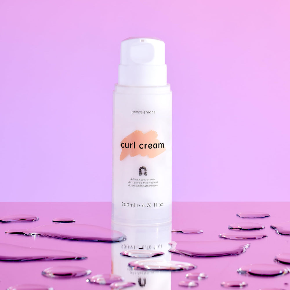 Georgiemane Curl Cream on model's curls showing moisture.