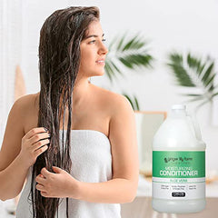 Close-up of hair with smooth shine after using Ginger Lily Farms conditioner.