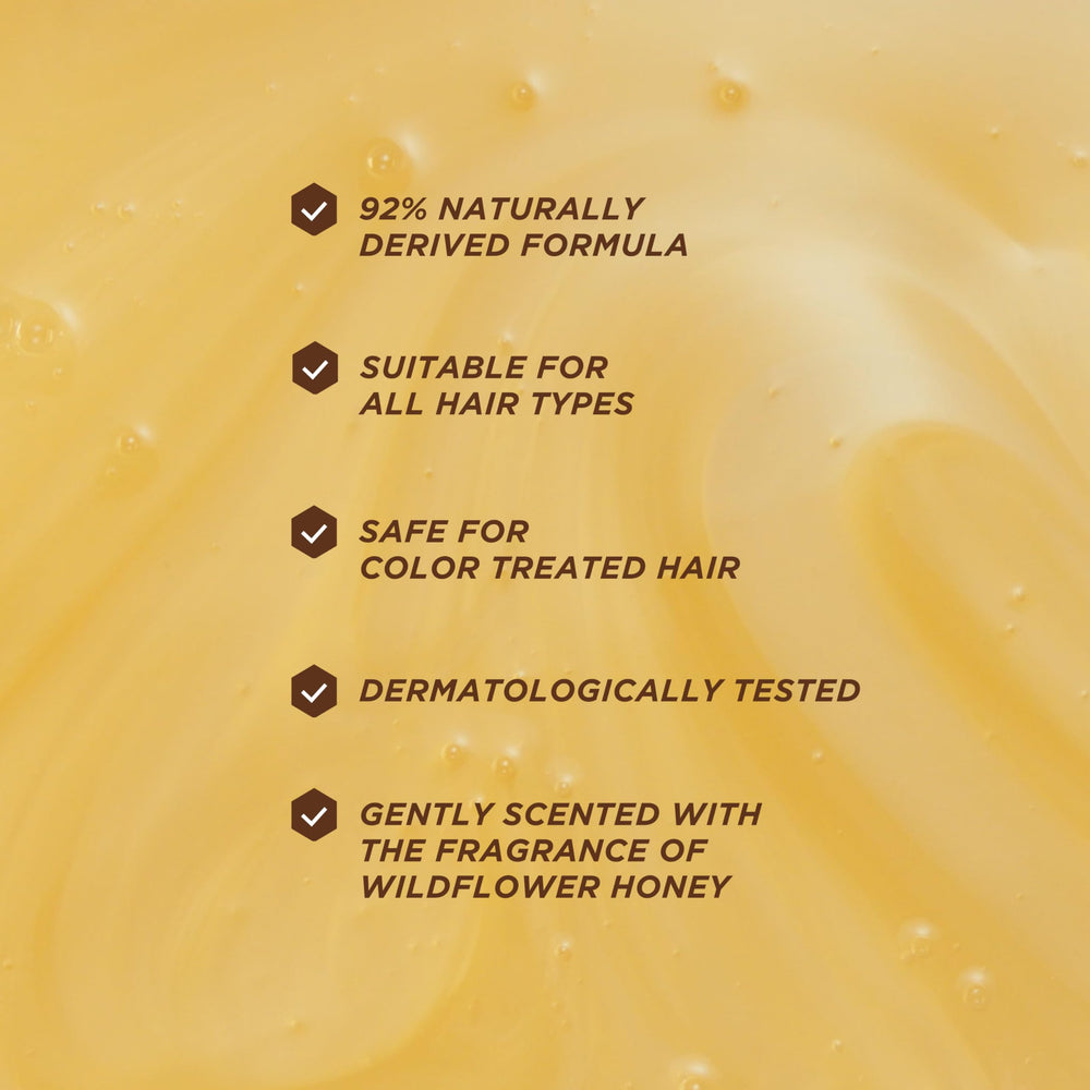 Gisou Honey Gloss Ceramide Therapy Hydrating Shampoo texture close-up emphasizes silky hydration.