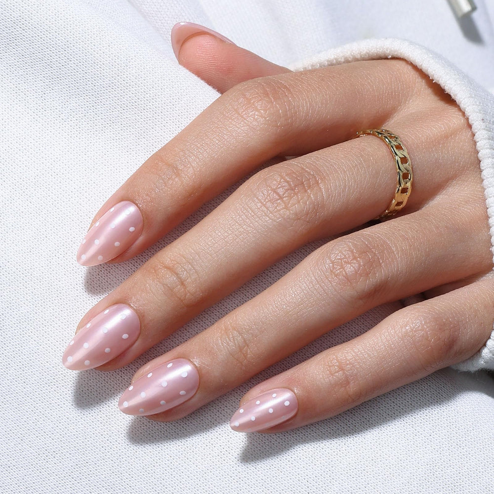 GJZEZ Iridescent pale pink nails offer shimmer without bulk for everyday wear.
