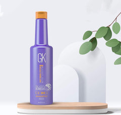 GK Hair Silver Bombshell Shampoo on damp blonde hair showing brassy tone neutralization