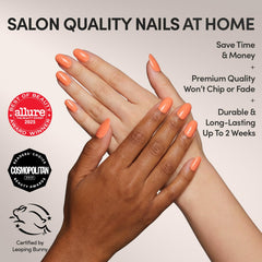 Glamnetic Apricot nails on a hand display glossy orange finish for a polished look.