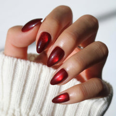Glamnetic Frosted Cranberry nails close-up with jelly finish for festive shine