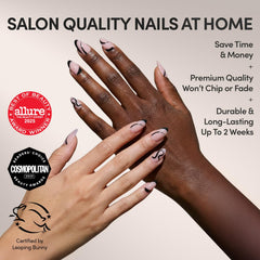 Glamnetic Ink Wave nails feature flowing black swirls for an elegant look.