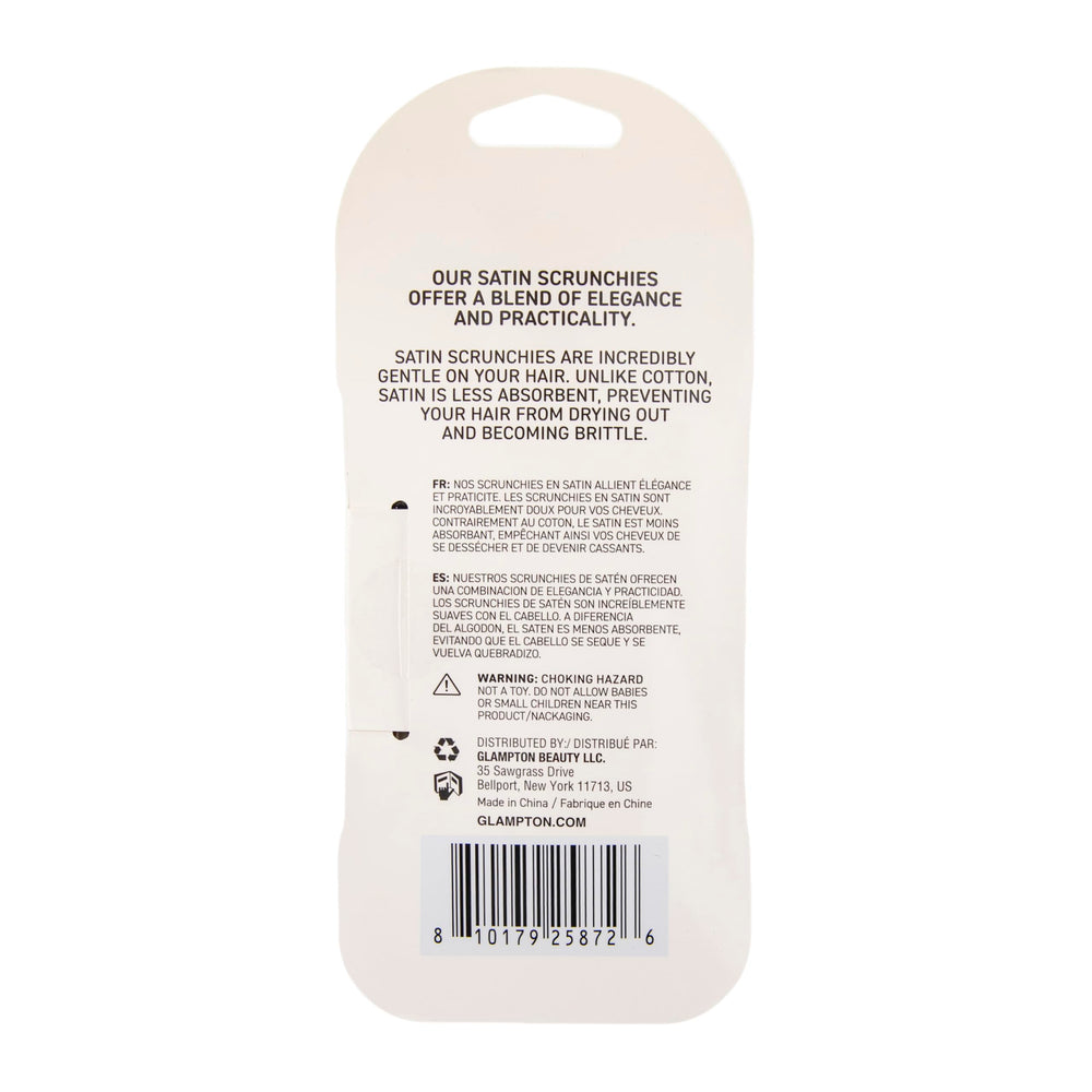 Glampton scrunchie on a pillow by bedside illustrating overnight use to protect hair and preserve moisture