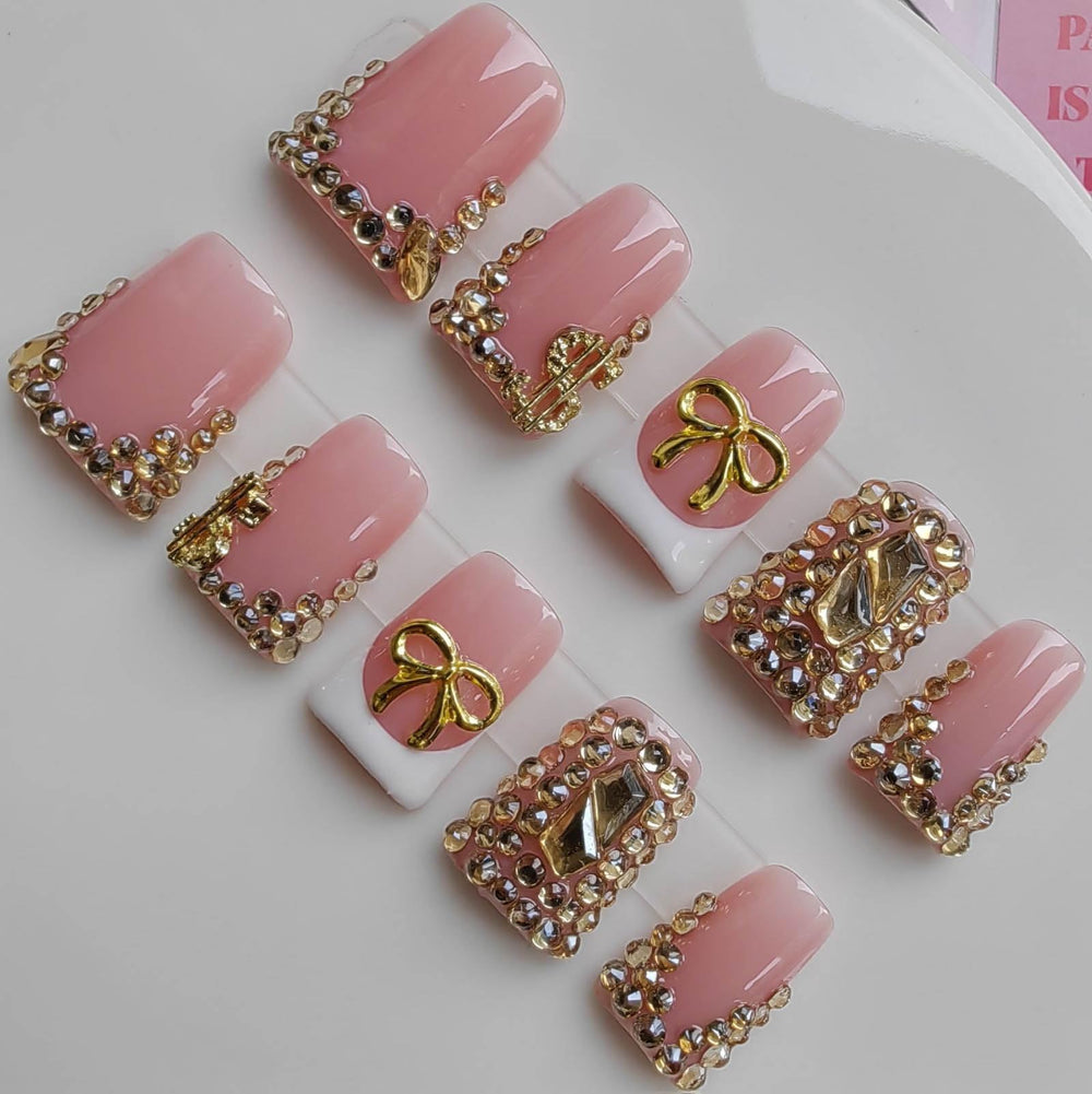 Gleamrain Duck press-on nails in pink with rhinestones and bow offer instant chic style