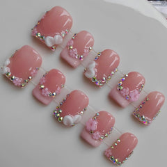 Gleamrain handmade nails with nude base and floral rhinestones for everyday elegance.
