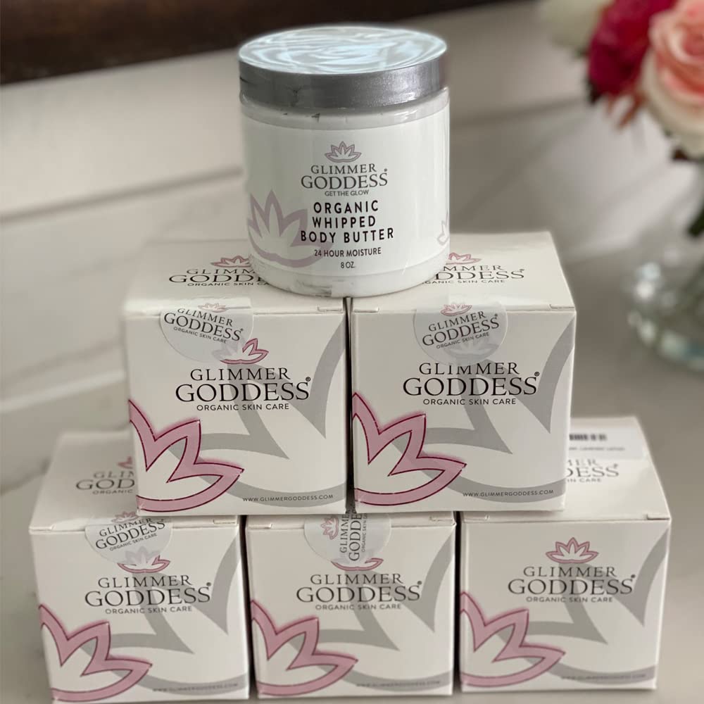 Hands applying Glimmer Goddess butter to skin glow