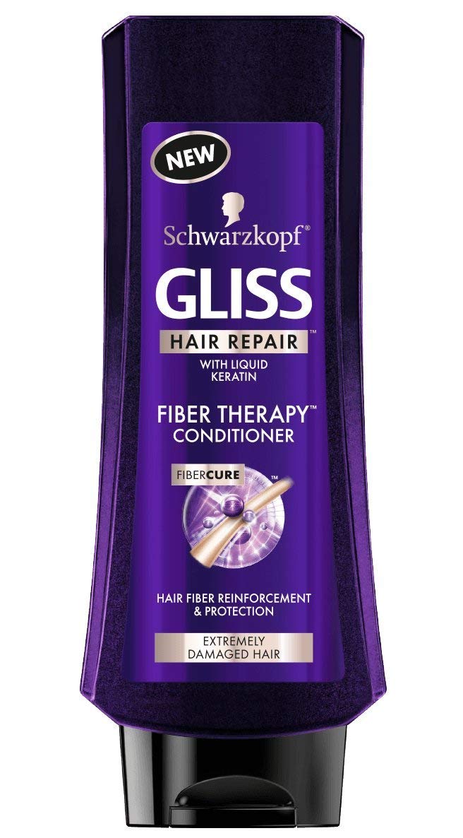 GLISS Fiber Therapy conditioner bottle helps smooth fibers and detangle for softer, healthier-looking hair.