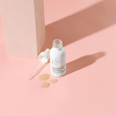 Glo Skin Beauty Hydra-Bright Alpha Arbutin Drops label close-up highlights clean, hydroquinone-free formulation.