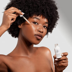 Glo Skin Beauty Hydra-Bright Alpha Arbutin Drops serum close-up shows smooth texture.