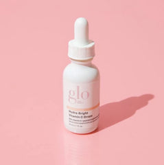 Glo Skin Beauty Hydra-Bright Drops on skin showing luminous glow