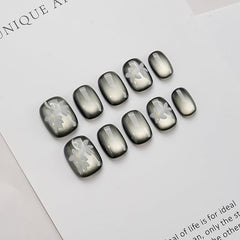 GLORS cateye black nails with white flowers for an at-home manicure boost