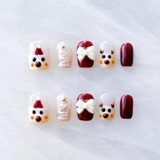 GLORS Christmas nails Santa bow design for a festive manicure at holiday parties.