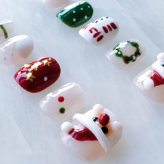 GLORS red and white backdrop nails for festive look.