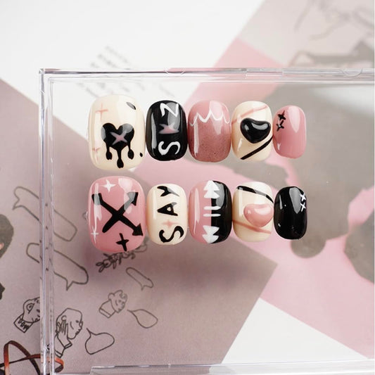 GLORS doodle graffiti nail sticker in black and pink for bold short nails.