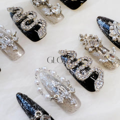 GLORS long almond nails in mixed elements suit fashion-forward wear.