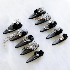 GLORS nails with crystal rhinestones catch light for brilliance.