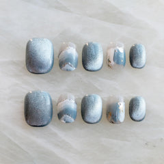 GLORS Purely Handmade Nails with blue and white glitter snow mountain design for festive daily wear.