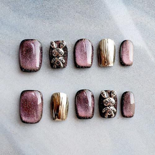 GLORS Purely Handmade nails close-up of purple gold bunny cat-eye finish