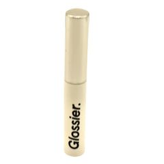 Glossier Boy Brow precision brush applying product for defined, natural brows.
