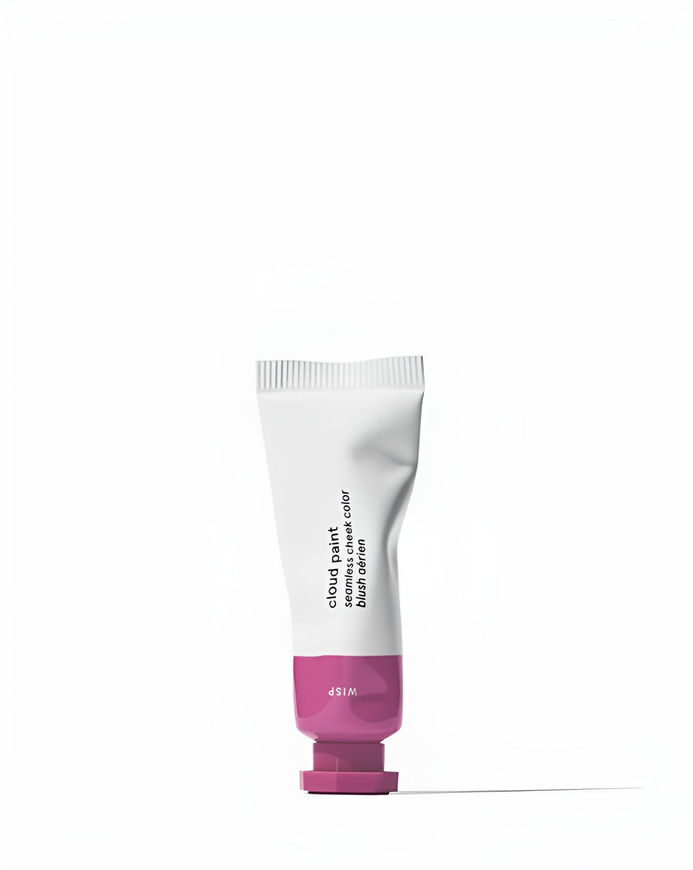 Glossier Cloud Paint Wisp swatch on skin shows a natural, buildable lilac glow