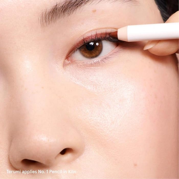 Glossier Lip Liner Black Cherry layered with gloss for depth.