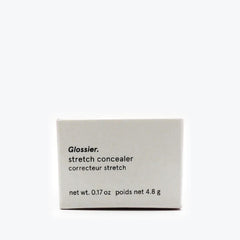 Glossier Stretch Concealer G10 dewy finish blended into skin for brightened, natural look