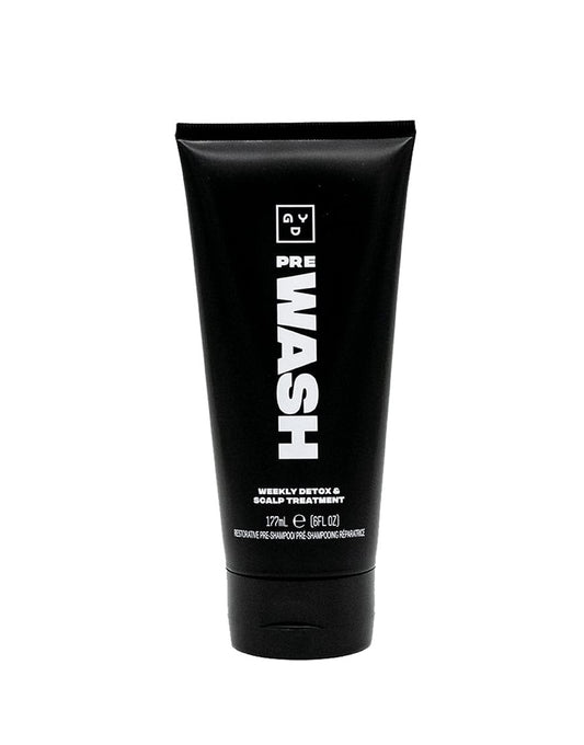 Good Dye Young scalp scrub bottle for gentle pre-wash cleansing.