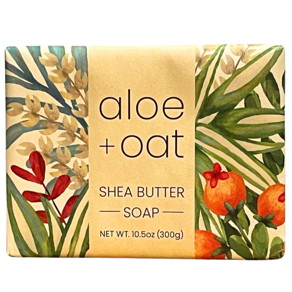 Greenwich Bay Aloe Oat Soap Bar on a wooden dish; soothing cleanse for sensitive skin.