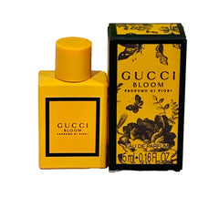 Gucci Bloom Profumo di Fiori mini bottle side view shows elegant travel design.