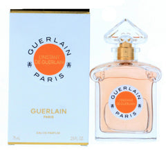 Guerlain L'Instant bottle close-up highlights amber floral notes for evening wear.