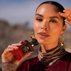 H HABIBI Sahara Rose perfume application on pulse points for lasting aroma.