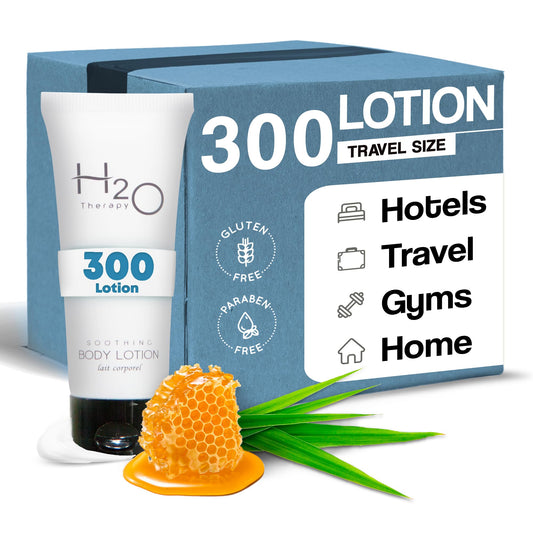 H2O Therapy Lotion travel-size bottle on hotel shelf for convenient guest use.