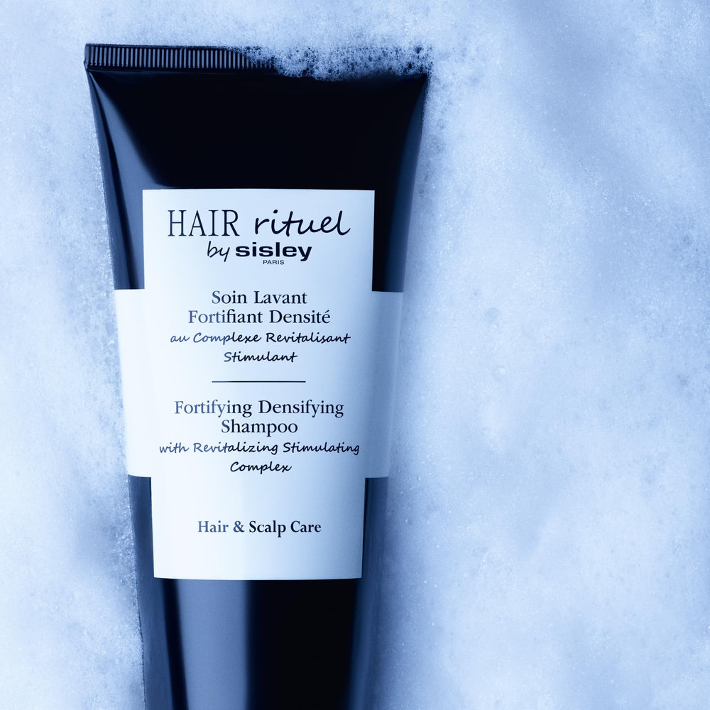 Hair Rituel by Sisley stimulating complex illustration showing scalp vitality.