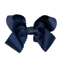 HAIRBOWS navy knotted wrap center bow on clip for secure daily wear.