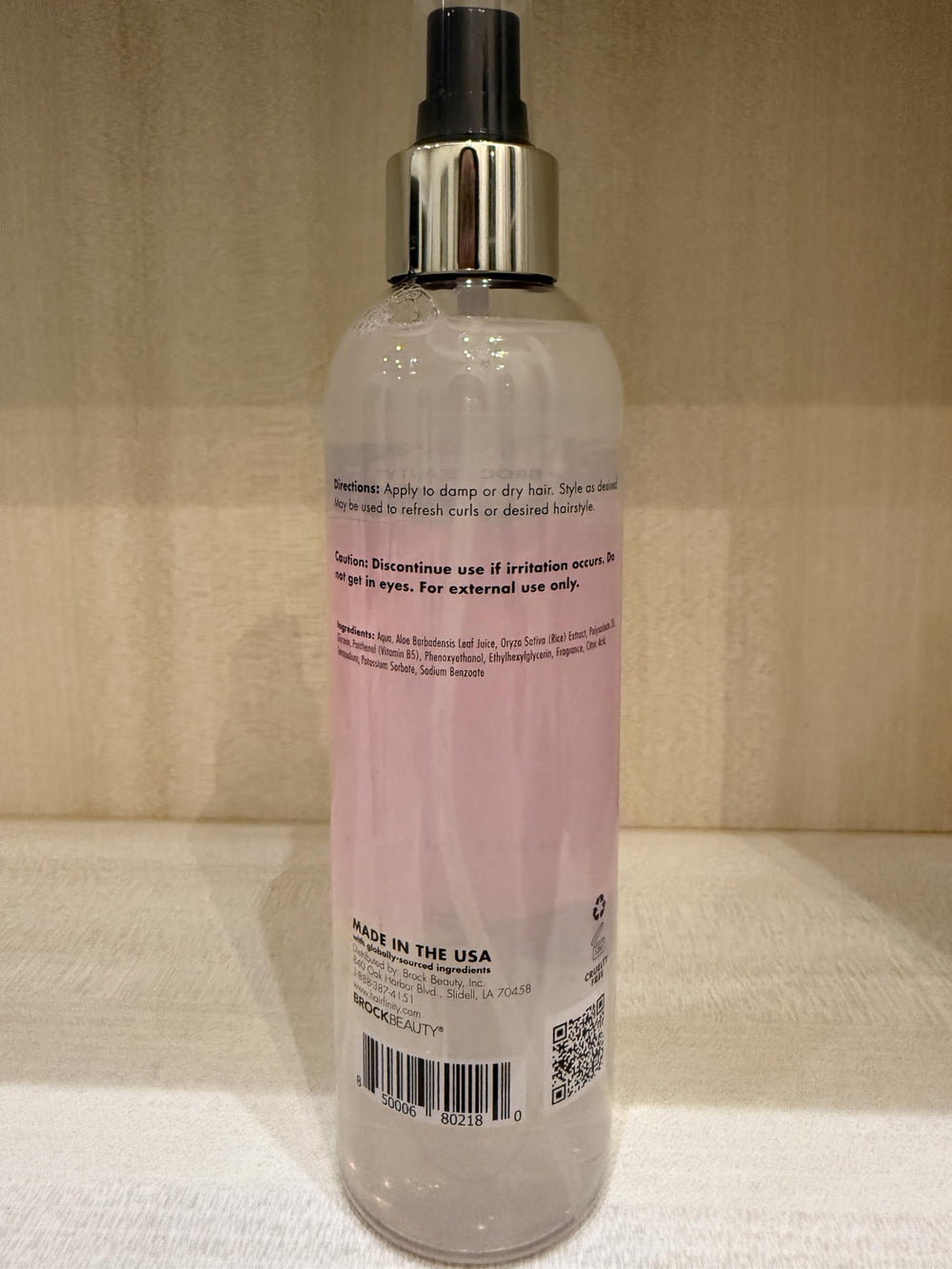 Hairfinity Rice Water Hair Mist in a bathroom scene.