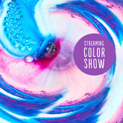 Hallu Unicorn Bath Bomb creates a vibrant pink and purple color swirl.